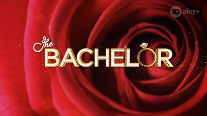 Title card for “The BACHELOR” over a swirling red rose, with a diamond ring forming the O.